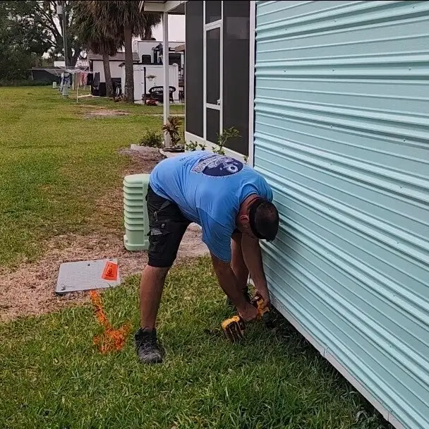 Tie-down install at a manufactured home